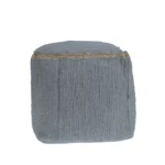 Goldoma foldable cube pouf ottoman in gray cotton with natural jute braid, placed in a living room as a footrest