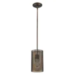 Hanging light suspended over a wooden dining table in a restaurant setting, casting warm light on the table.