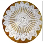 Vintage lace table mats in shabby chic style on a wooden table