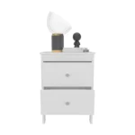 Modern white nightstand with two drawers beside a bed in a contemporary bedroom