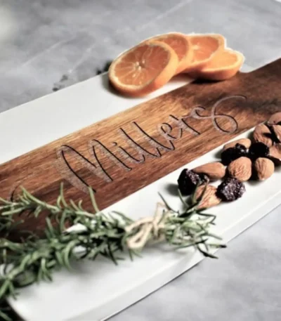 Charcuterie board set with marble and acacia wood boards on a table