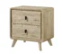 Mid century nightstand with two drawers in warm wood finish beside a bed
