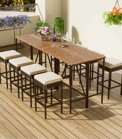 Modern 10-piece outdoor dining set with acacia wood table and 8 PE rattan wicker stools on a patio