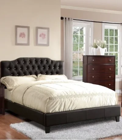 Modern faux leather queen bed with tufted upholstered headboard in a stylish bedroom setting