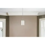 Close-up of the HMS chandelier's frosted glass shades and crystal accents, revealing the antique silver finish on the