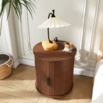 Modern cylinder end table with built-in charging station and sliding door storage