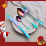 Elegant gold flatware set with fork, knife, and spoon on a white tablecloth