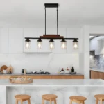 Close-up of the metal and wood construction on the farmhouse industrial chandelier, showing the clear glass shades and