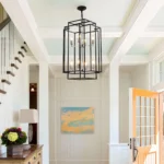 Goldoma 8-light pendant chandelier in a modern living space, illuminated by natural light, highlighting its open
