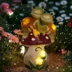 Solar turtle statue glowing in garden at dusk with mushrooms