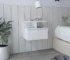 White wall mounted nightstand with one drawer in a modern bedroom