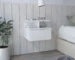 White wall mounted nightstand with one drawer in a modern bedroom