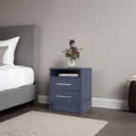 Kronos Blue nightstand with two drawers and open shelf in a modern bedroom setting.