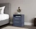 Blue nightstand with drawers in a modern bedroom setting
