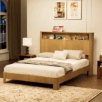 Goldoma adjustable queen bed frame with wavy storage headboard and built-in charging station in a modern bedroom