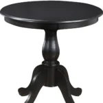 30 inch round dining table with black pedestal base in a modern dining room