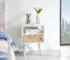 Modern side table solid wood with rattan drawer and tapered legs in a living room