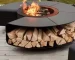 Outdoor fire pit chimnea on patio with flames and grill grate