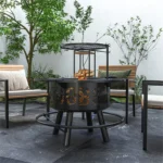 Black outdoor fire pit with glowing flames in a backyard setting