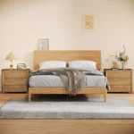 Beige white 3-drawer farmhouse nightstand with ample storage and a large tabletop, perfect for a modern rustic bedroom.