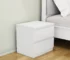 White nightstand with drawers featuring handle-free design and thickened top plate in a modern bedroom