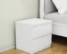 White nightstand with drawers featuring handle-free design and thickened top plate in a modern bedroom