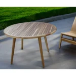 36 inch natural solid wood outdoor dining table with rounded shape on a patio