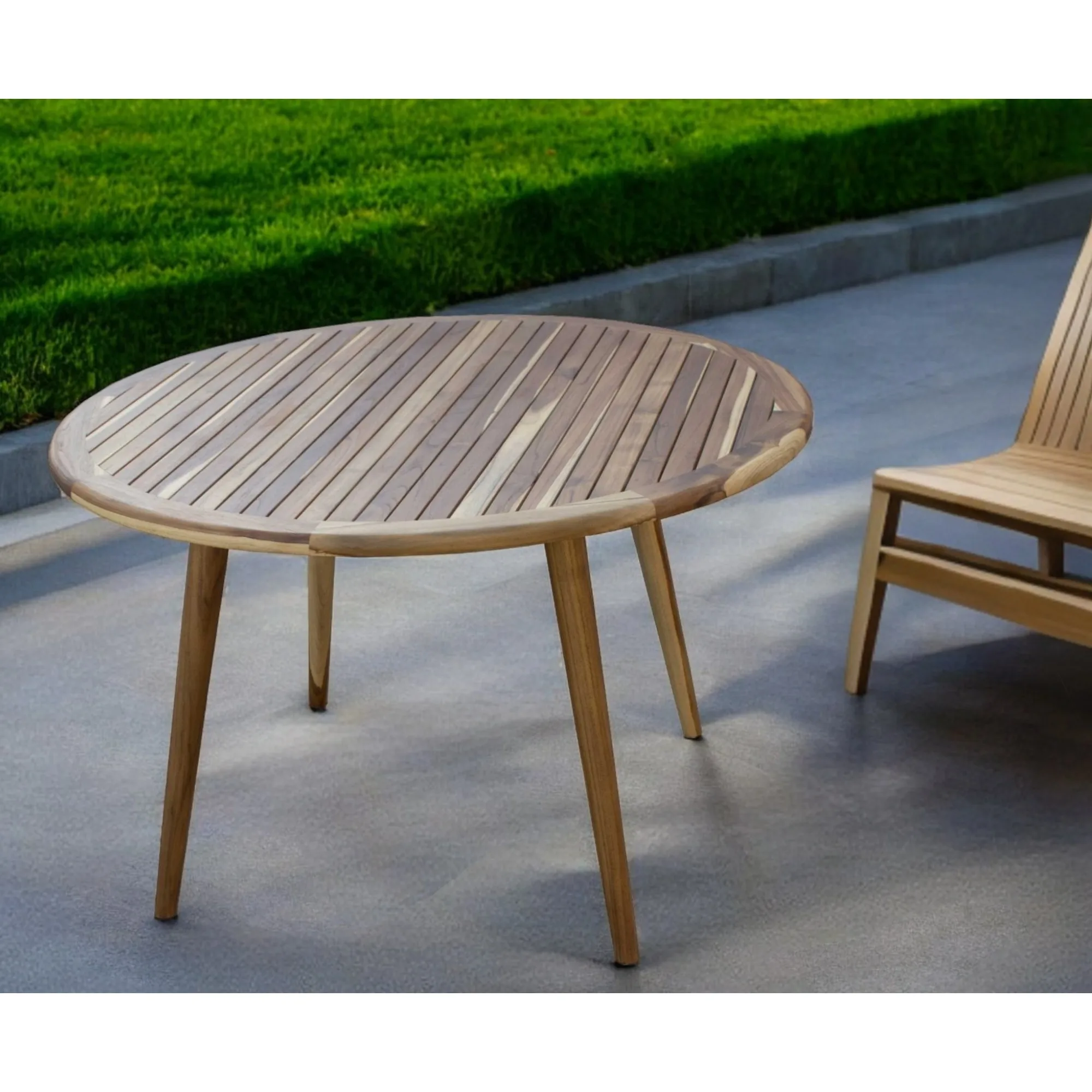 Natural rounded solid wood dining table with smooth finish on a patio