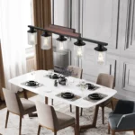 Alternate angle of the metal wood chandelier hanging from a sloped ceiling, highlighting the chain suspension and