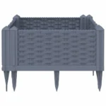 Blue grey polypropylene medium garden planter with flowers on patio