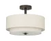 Semi flush 2-tier fabric ceiling pendant light in beige, hanging in a living room with soft natural light.