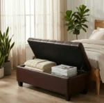 Goldoma dark brown leather storage ottoman bench in living room with pillows