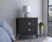 Amara two-drawer black wood nightstand in a modern bedroom setting