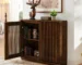 Mid century sideboard with fluted doors and outlet holes in living room