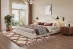 Goldoma adjustable bed frame king with soft boucle upholstered curved headboard and eco-friendly wood frame in a modern bedroom