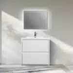 Modern freestanding bathroom vanity with glossy white MFC cabinet and marble countertop, placed in a bright bathroom