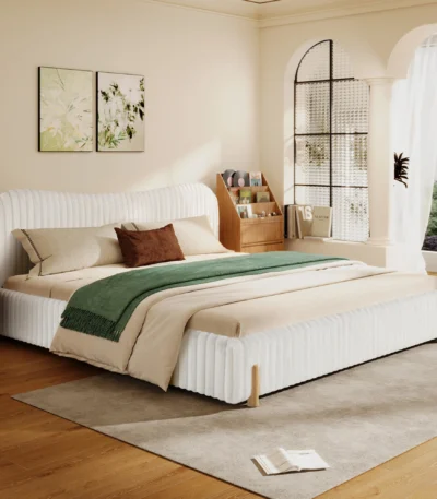Goldoma plush upholstered king bed with wavy headboard and vertical stitching in white boucle fabric