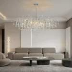 Modern crystal chandelier in chrome finish illuminating a minimalist dining room