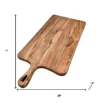 Large wooden cutting board with knife and cheese on a kitchen counter
