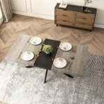Retro extendable dining table with grey Carole top, black embossed center plate, and storage box in a modern dining room setting