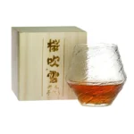 Set of hazy wine glasses with hammer pattern and snowflake design on a wooden table