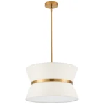 Modern chandelier with white fabric shade and brass finish hanging over kitchen island