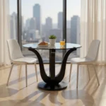 Round glass dining table with black wood pedestal base in a modern dining room setting