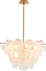 Vintage gold chandelier hanging over a dining table with warm glow