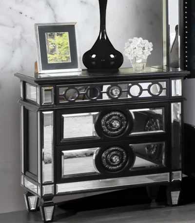 Black mirrored nightstand with 2 drawers sitting beside a bed in a glam luxury bedroom, featuring a glossy wood finish and reflective mirrored accents.