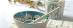 Japanese ceramic dinnerware set with hand-drawn cat design on blue rectangular plate and bowl