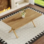 Modern square MDF wood dining table with X-shaped metal base in a dining room setting