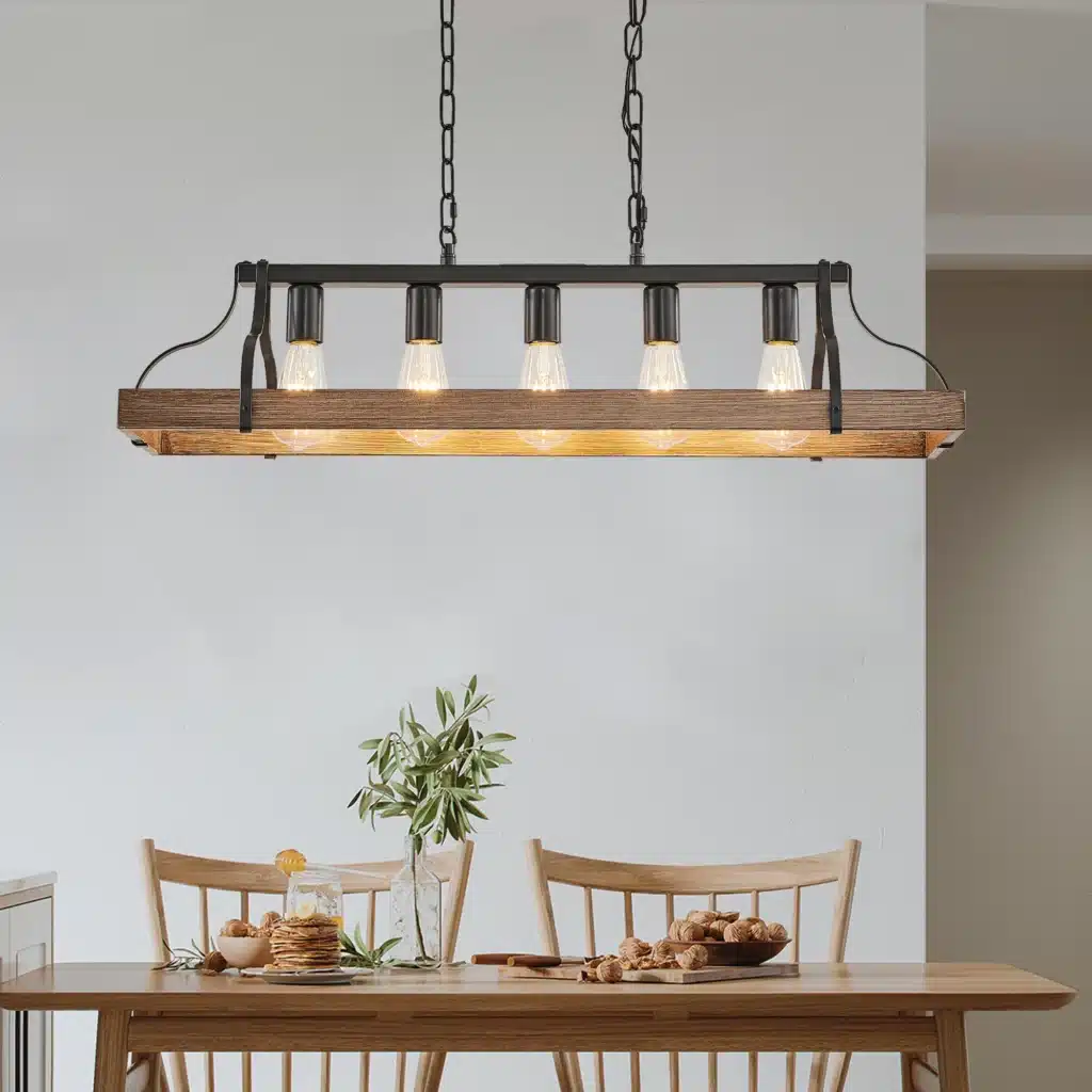 Black walnut pendant light hanging over a dining table in a modern farmhouse interior