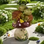 Solar turtle statue glowing in garden at dusk with mushrooms