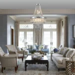 Modern crystal chandelier in chrome finish with clear K9 crystals hanging over a dining table